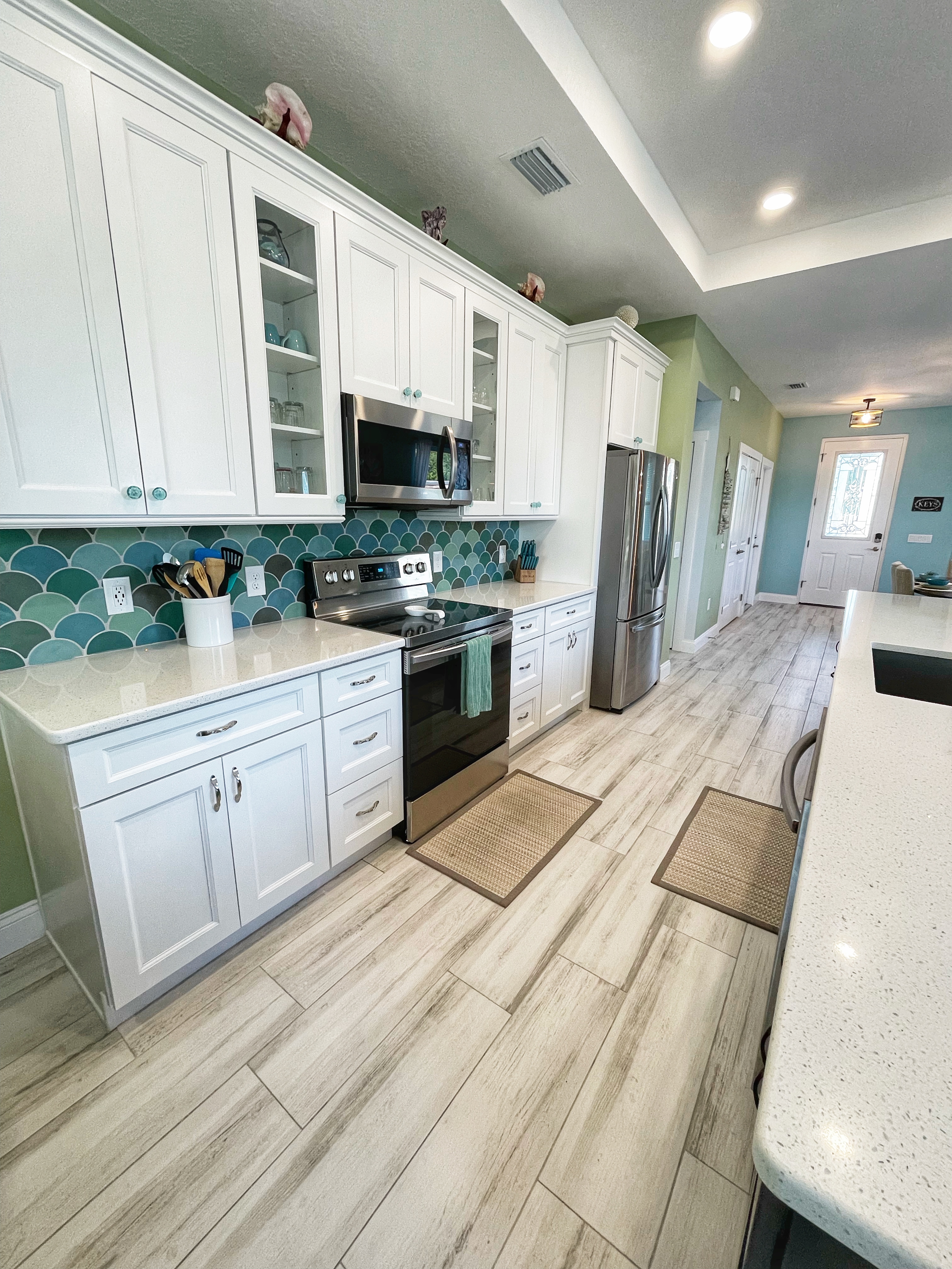 Kitchen range, microwave, and storage